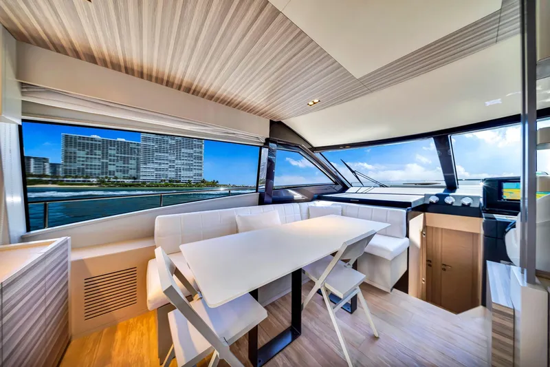  Yacht Photos Pics Luxurious interior of 2022 Ferretti Yachts 670 with ocean view and modern dining area.