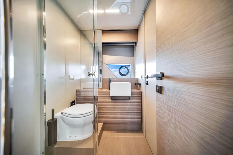  Yacht Photos Pics Luxurious bathroom interior of 2022 Ferretti Yachts 670, featuring modern fixtures and elegant design.