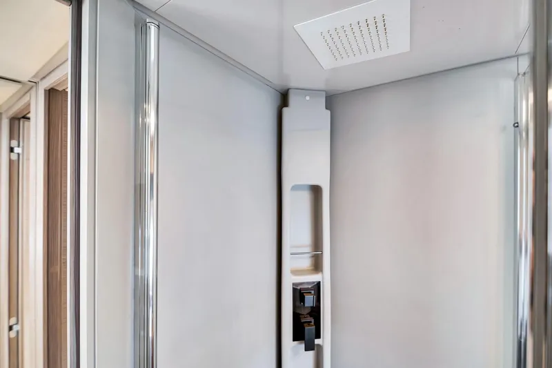  Yacht Photos Pics Modern shower interior on 2022 Ferretti Yachts 670, featuring sleek design and fixtures.