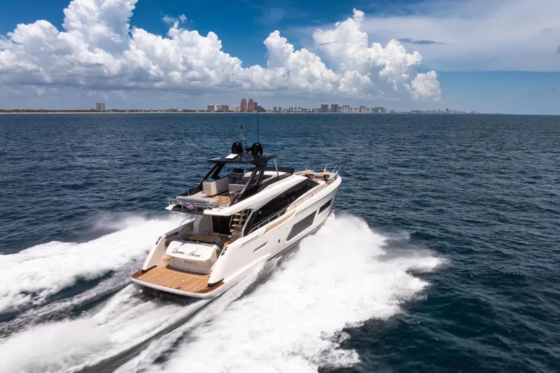  Yacht Photos Pics 2022 Ferretti Yachts 670 cruising on open sea under a clear blue sky.