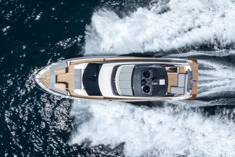  Yacht Photos Pics Aerial view of 2022 Ferretti Yachts 670 cruising on open water.