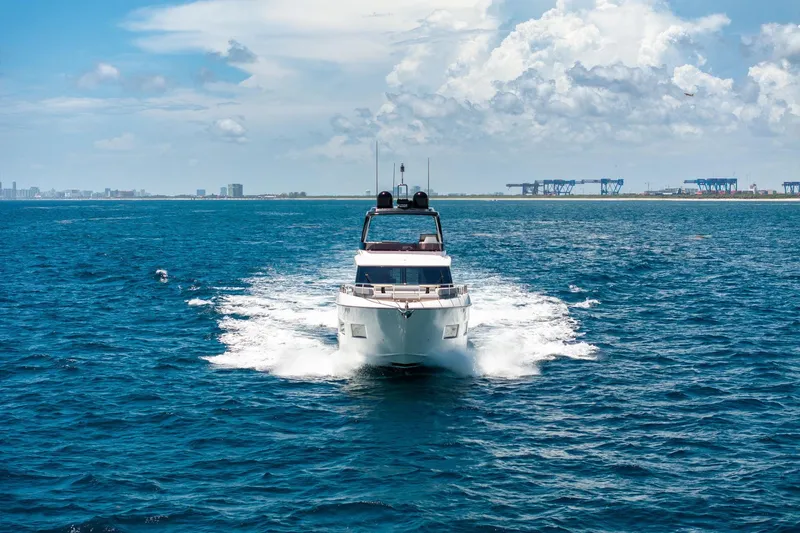  Yacht Photos Pics 2022 Ferretti Yachts 670 cruising on open sea under clear skies.