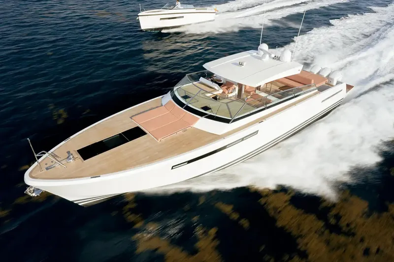  Yacht Photos Pics 2024 Delta Powerboats 60 Open cruising on water, showcasing sleek design and luxury features.
