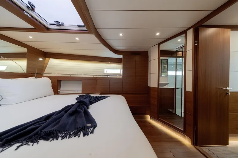  Yacht Photos Pics Luxurious cabin interior of 2024 Delta Powerboats 60 Open, featuring elegant wood finishes.