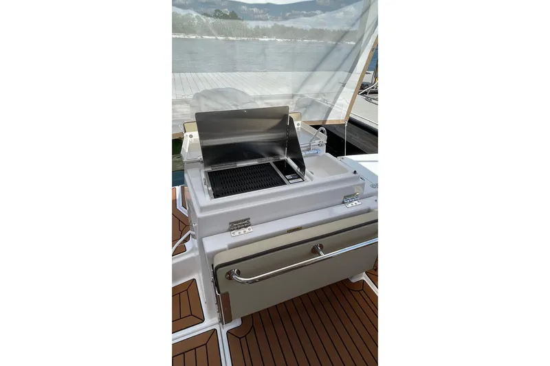  Yacht Photos Pics Outdoor grill on 2025 Ranger Tugs R-27 Seakeeper Ride boat deck.