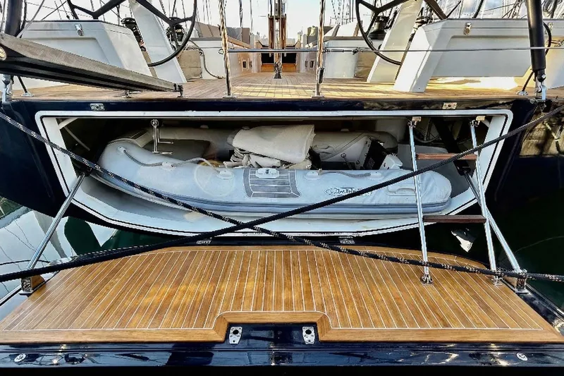 Nemo Yacht Photos Pics 2022 Solaris 55 yacht with open storage compartment revealing an inflatable boat.
