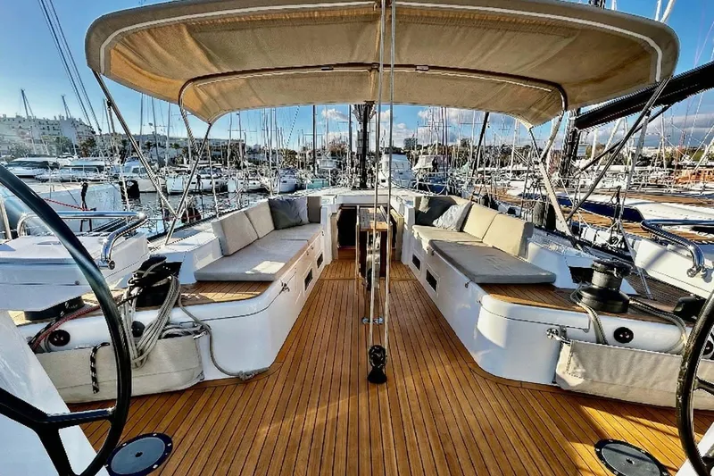 Nemo Yacht Photos Pics Luxurious 2022 Solaris 55 yacht with spacious deck and elegant seating in marina.