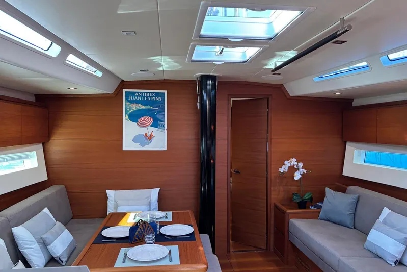 Nemo Yacht Photos Pics Luxurious interior of 2022 Solaris 55 yacht with elegant dining area and modern decor.