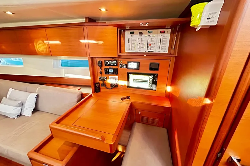 Nemo Yacht Photos Pics Luxurious interior of 2022 Solaris 55 yacht with navigation controls and seating area.