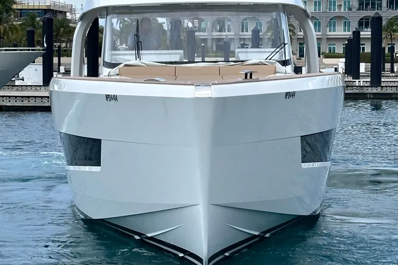 M2o Yacht Photos Pics 2024 Fjord 53 XL luxury yacht docked in a marina, front view.