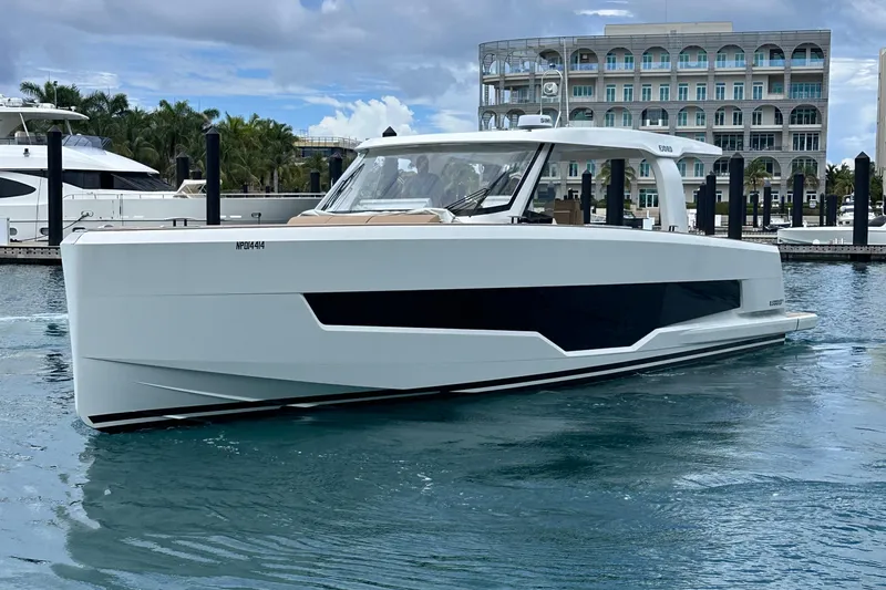 M2o Yacht Photos Pics 2024 Fjord 53 XL yacht docked in marina, modern design, clear skies.