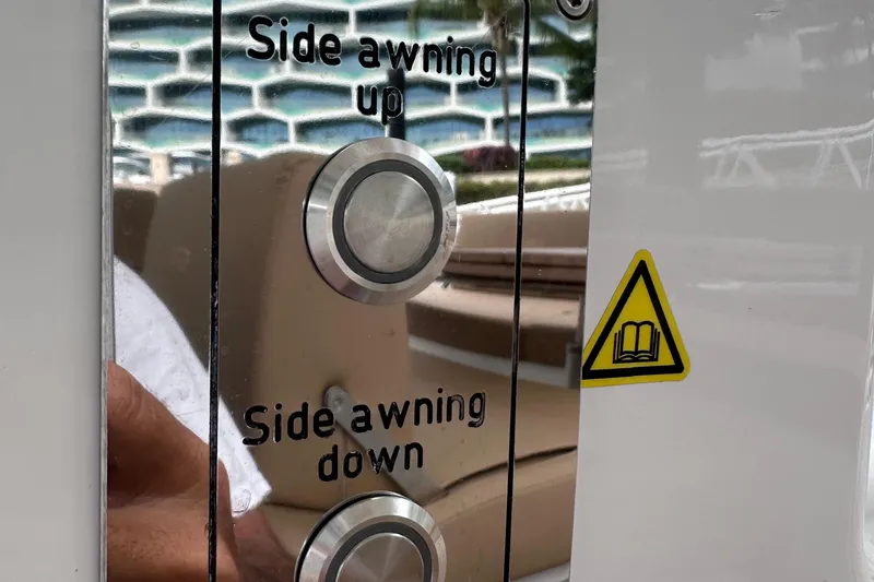 M2o Yacht Photos Pics Control panel for side awning on 2024 Fjord 53 XL yacht, featuring up and down buttons.