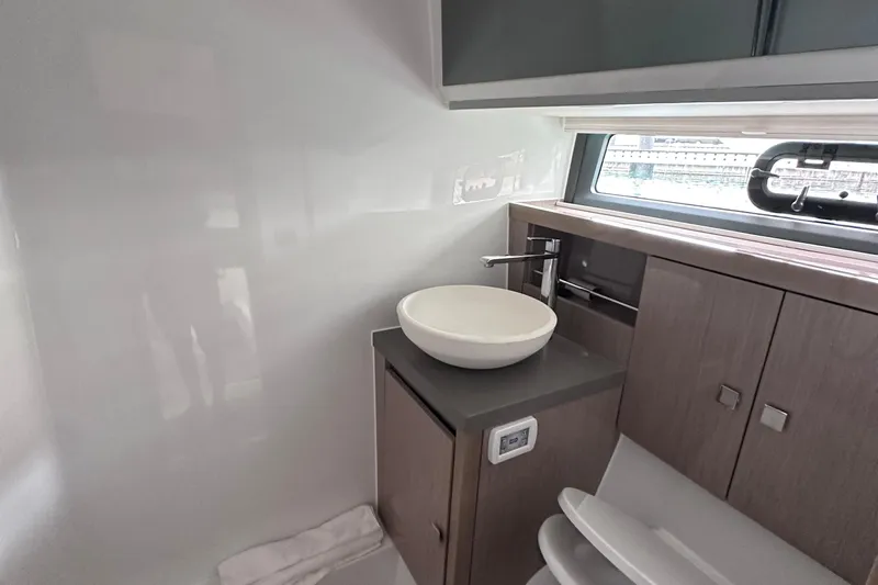 M2o Yacht Photos Pics Modern bathroom interior of 2024 Fjord 53 XL yacht with sleek sink and cabinetry.