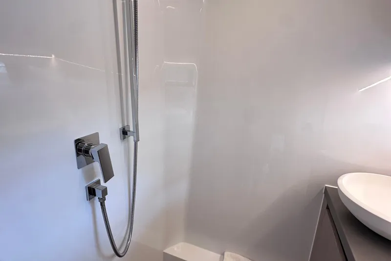 M2o Yacht Photos Pics Modern bathroom in 2024 Fjord 53 XL yacht with sleek fixtures and white basin.