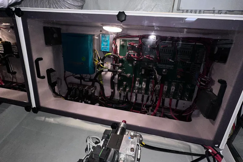 M2o Yacht Photos Pics Electrical panel inside 2024 Fjord 53 XL boat, showcasing wiring and components.