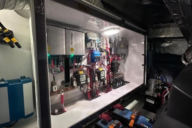 M2o Yacht Photos Pics Electrical system inside 2024 Fjord 53 XL yacht, showcasing wiring and components.