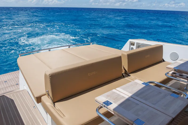 M2o Yacht Photos Pics Luxurious 2024 Fjord 53 XL yacht with sunbathing deck, cruising on open blue sea.