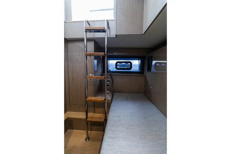 M2o Yacht Photos Pics Interior of 2024 Fjord 53 XL yacht with wooden ladder and cozy cabin space.