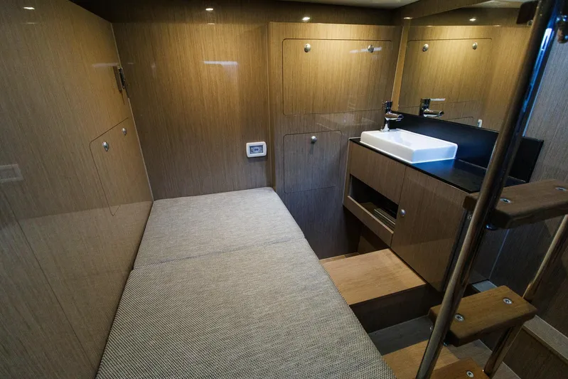 M2o Yacht Photos Pics 2024 Fjord 53 XL interior cabin with wooden finish and compact sink area.