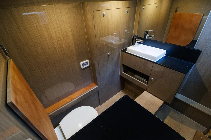 M2o Yacht Photos Pics Luxurious bathroom interior of 2024 Fjord 53 XL yacht with modern fixtures and wood finish.