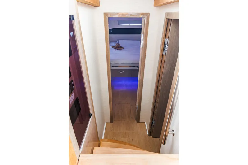 M2o Yacht Photos Pics 2024 Fjord 53 XL interior with wooden stairs and modern bedroom view.