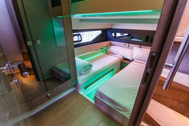 M2o Yacht Photos Pics Luxurious 2024 Fjord 53 XL yacht cabin with modern lighting and twin beds.