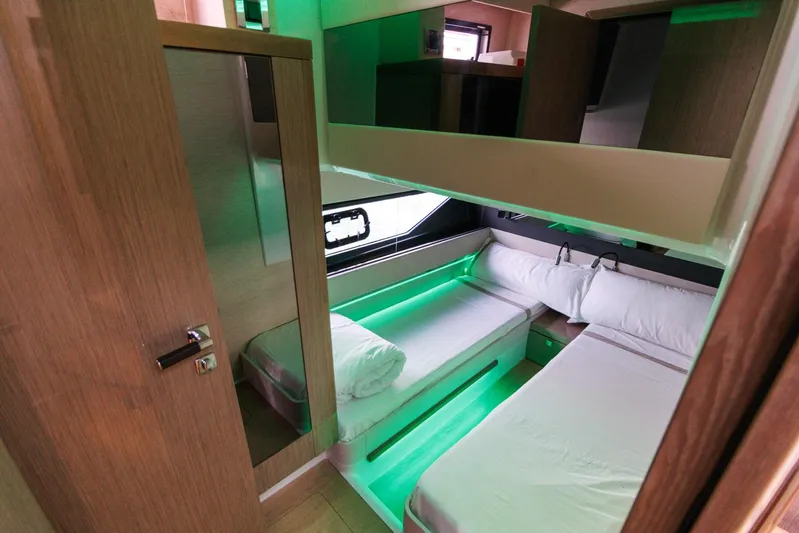 M2o Yacht Photos Pics 2024 Fjord 53 XL cabin interior with modern design and ambient green lighting.