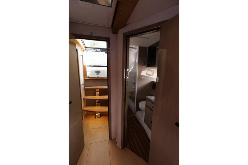 M2o Yacht Photos Pics Interior of 2024 Fjord 53 XL yacht, featuring wooden stairs and modern bathroom.