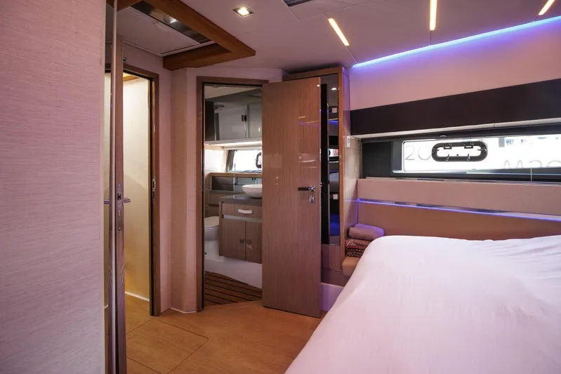 M2o Yacht Photos Pics Luxurious interior of 2024 Fjord 53 XL yacht with modern bedroom and bathroom.