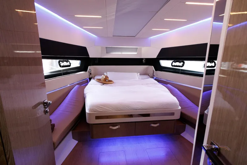M2o Yacht Photos Pics Luxurious 2024 Fjord 53 XL yacht cabin with modern lighting and cozy bedding.