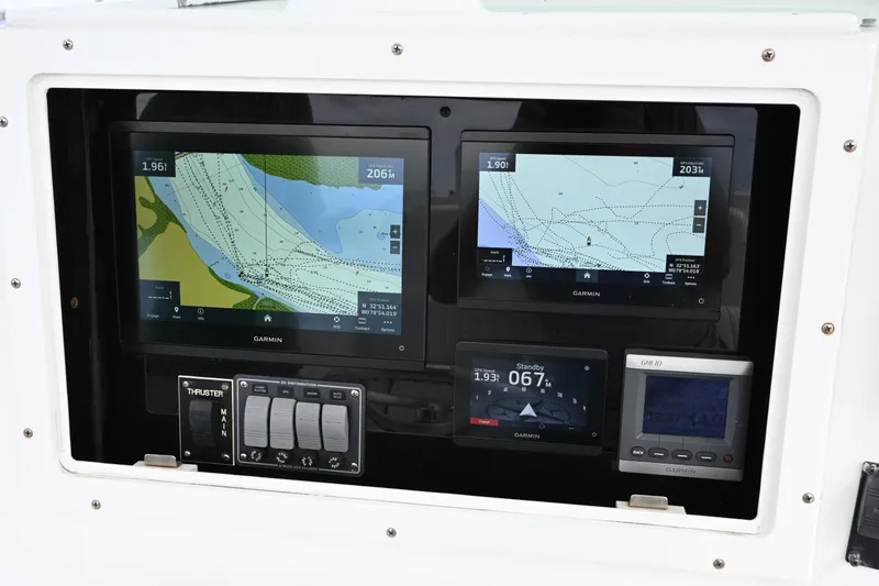  Yacht Photos Pics 2008 Regulator 32 Forward Seating boat with Garmin navigation displays and control panel.