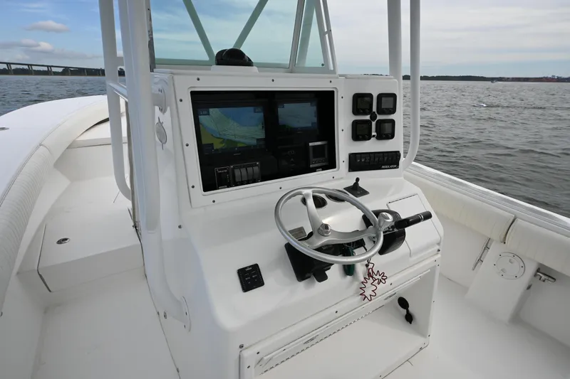  Yacht Photos Pics 2008 Regulator 32 Forward Seating boat console with navigation screens on open water.