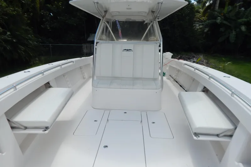  Yacht Photos Pics 2013 Invincible 42 Open Fisherman boat interior with seating and console.