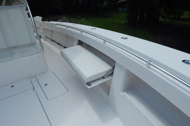  Yacht Photos Pics 2013 Invincible 42 Open Fisherman boat interior with foldable seat and sleek design.