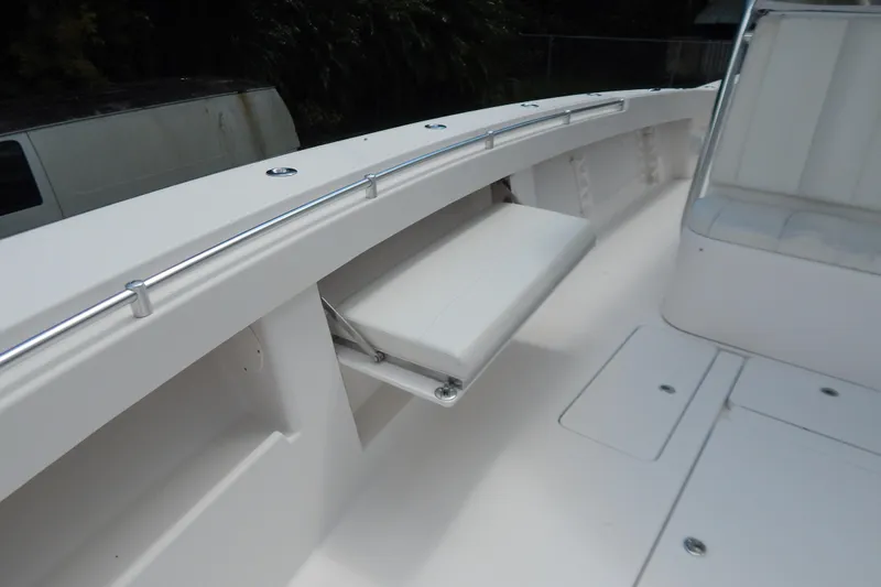  Yacht Photos Pics 2013 Invincible 42 Open Fisherman boat interior with foldable seating and sleek design.