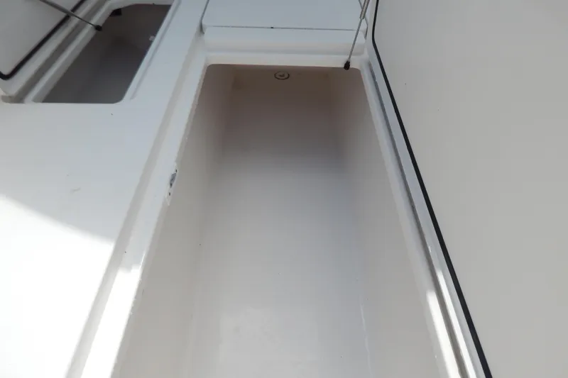  Yacht Photos Pics 2013 Invincible 42 Open Fisherman boat storage compartment, clean and spacious design.