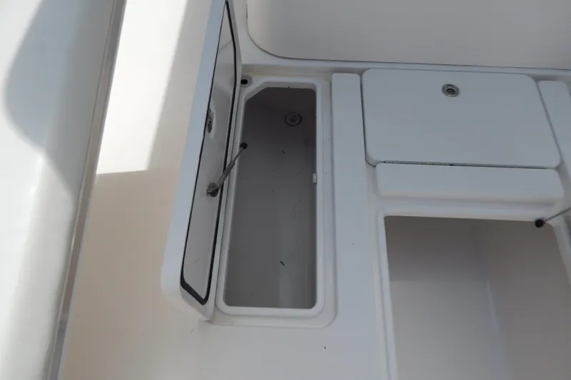  Yacht Photos Pics Open storage compartment on 2013 Invincible 42 Open Fisherman boat.
