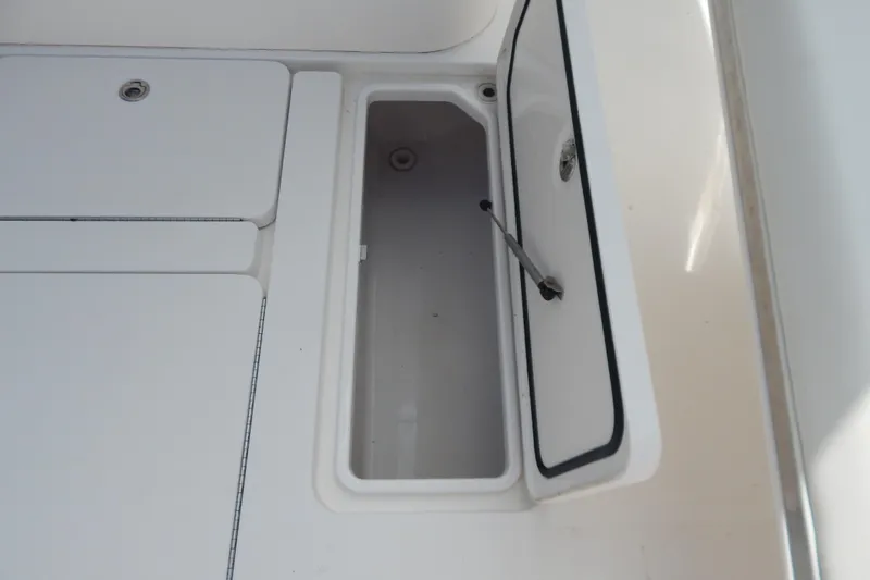  Yacht Photos Pics Open storage compartment on 2013 Invincible 42 Open Fisherman boat deck.