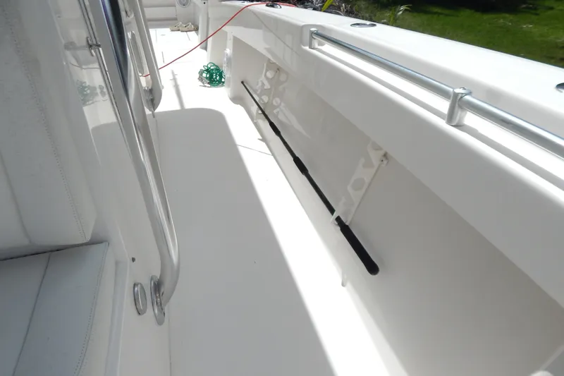  Yacht Photos Pics 2013 Invincible 42 Open Fisherman boat deck with rod holders and railing.