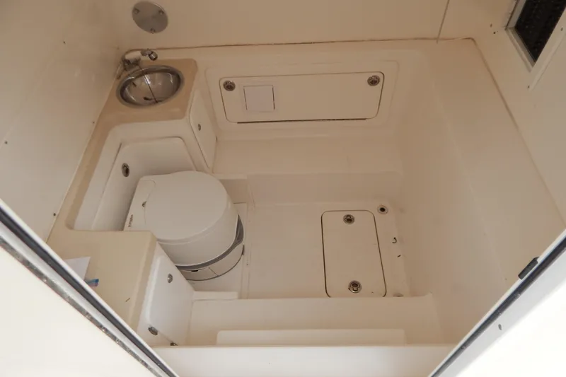  Yacht Photos Pics 2013 Invincible 42 Open Fisherman boat interior with compact bathroom amenities.