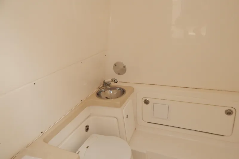  Yacht Photos Pics 2013 Invincible 42 Open Fisherman boat bathroom with sink and toilet.