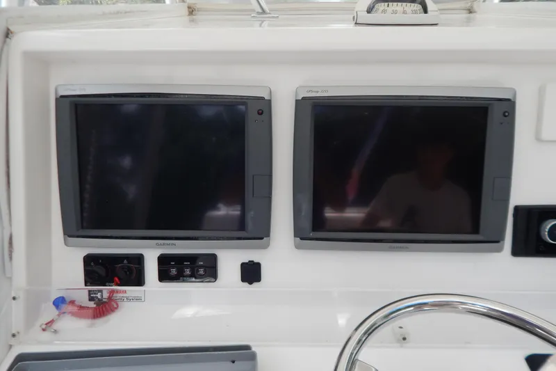  Yacht Photos Pics Control panel of 2013 Invincible 42 Open Fisherman with Garmin displays.