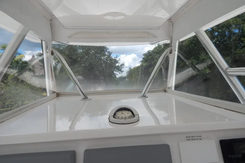  Yacht Photos Pics Interior view of 2013 Invincible 42 Open Fisherman boat, showcasing dashboard and windshield.