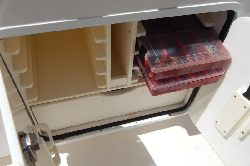  Yacht Photos Pics Storage compartment with tackle boxes on a 2013 Invincible 42 Open Fisherman boat.