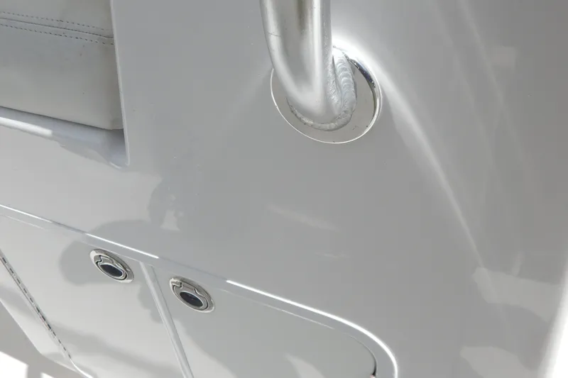  Yacht Photos Pics Close-up of 2013 Invincible 42 Open Fisherman boat's sleek, white surface and fittings.