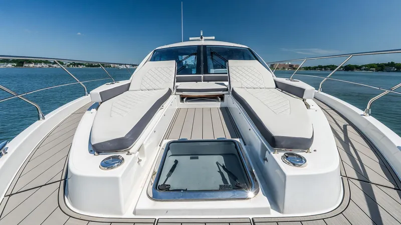 Belle Yacht Photos Pics 2018 Cruisers Yachts 50 Cantius deck with luxurious sun loungers and scenic water view.