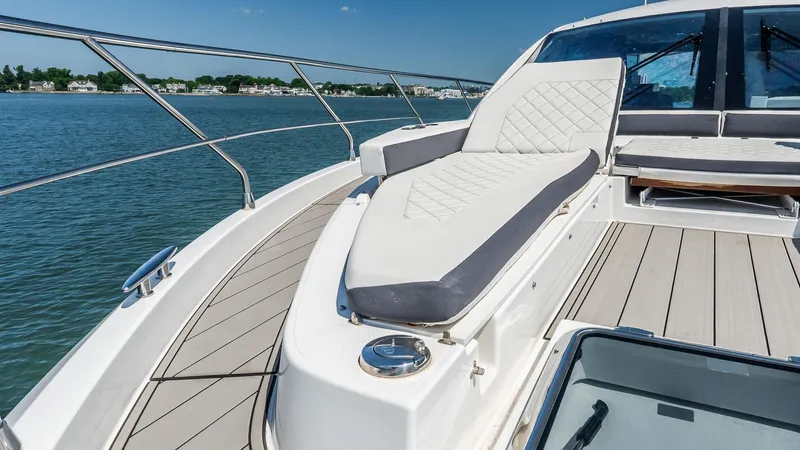 Belle Yacht Photos Pics 2018 Cruisers Yachts 50 Cantius deck with luxurious seating and scenic water view.