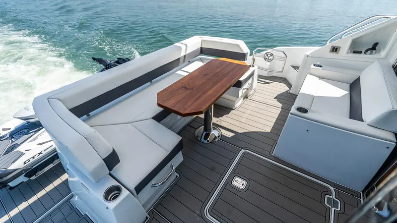 Belle Yacht Photos Pics Luxurious 2018 Cruisers Yachts 50 Cantius deck with elegant seating and wooden table.