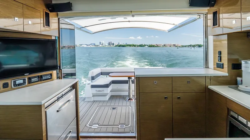 Belle Yacht Photos Pics Luxurious interior of 2018 Cruisers Yachts 50 Cantius with ocean view and modern amenities.