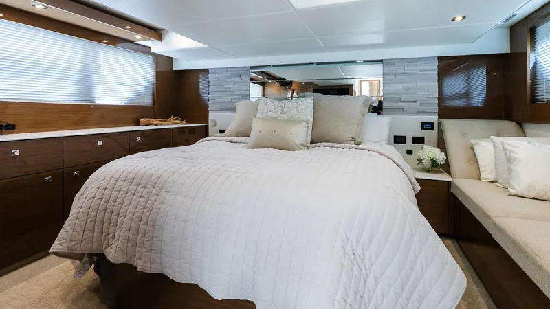Belle Yacht Photos Pics Luxurious bedroom interior of 2018 Cruisers Yachts 50 Cantius with elegant bedding and modern decor.